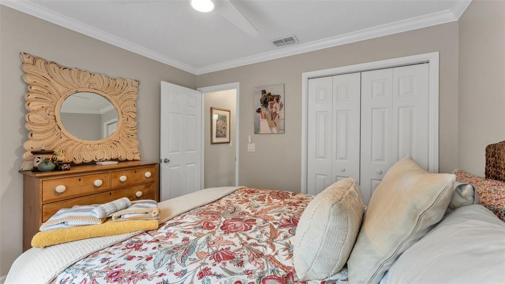 422 Mc Cormick Road Apopka, FL 32703 - Photo 38 of 95 a bedroom with a bed and a dresser