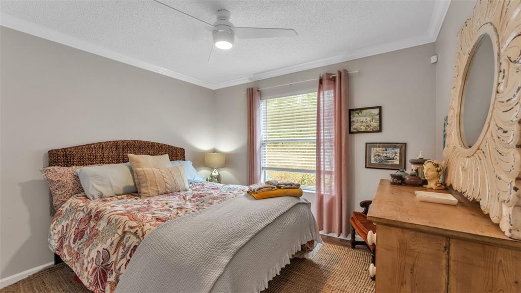 422 Mc Cormick Road Apopka, FL 32703 - Photo 39 of 95 a bedroom with a bed and a couch