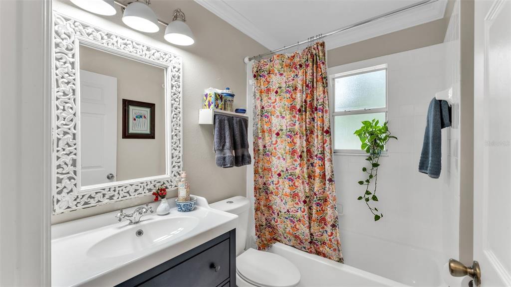 422 Mc Cormick Road Apopka, FL 32703 - Photo 40 of 95 a bathroom with a sink toilet and shower