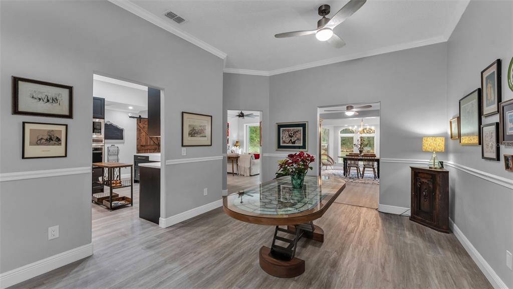 422 Mc Cormick Road Apopka, FL 32703 - Photo 10 of 95 a living room with furniture and a wooden floor