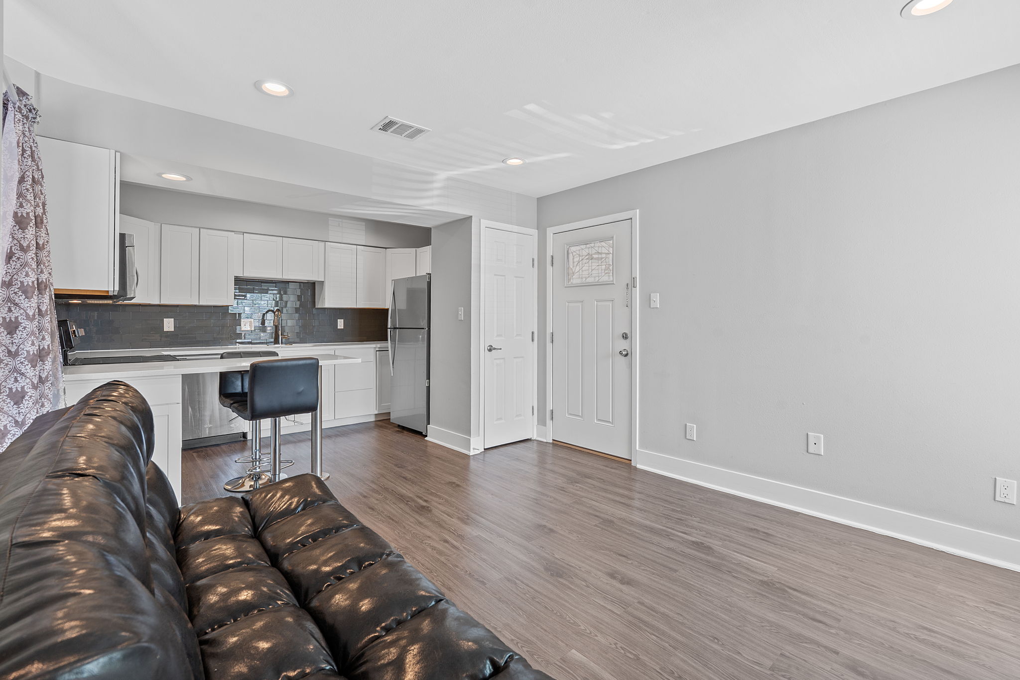 935 La Posada Drive, Unit 254 Austin, TX 78752 - Photo 5 of 18 Living room featuring recessed lighting and dark wood-style floors