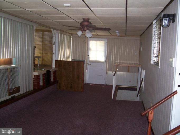 7309 Dooman Road Windsor Mill, MD 21244 - Photo 6 of 21 ENCLOSED PORCH OFF BACK OF HOUSE