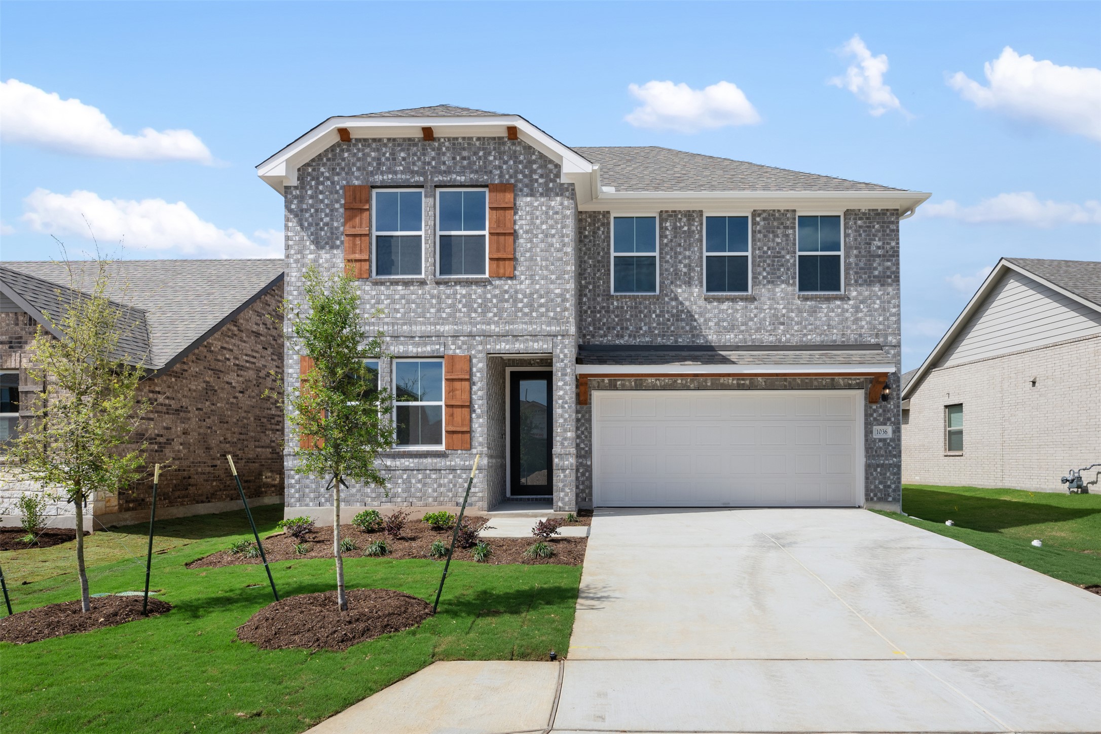 1036 Sienna Bear Road Georgetown, TX 78633 - Photo 17 of 33 a front view of a house with a yard and garage
