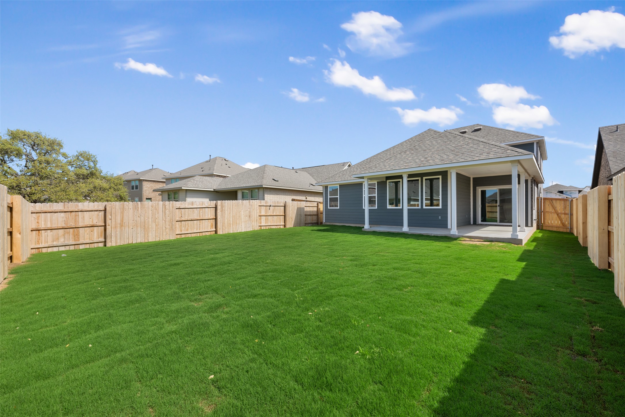 1036 Sienna Bear Road Georgetown, TX 78633 - Photo 18 of 33 a view of a house with a backyard