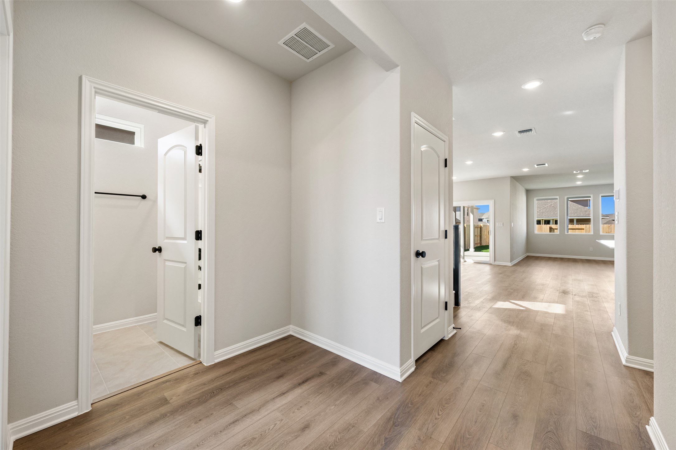 1036 Sienna Bear Road Georgetown, TX 78633 - Photo 28 of 33 a view of a hallway with wooden floor