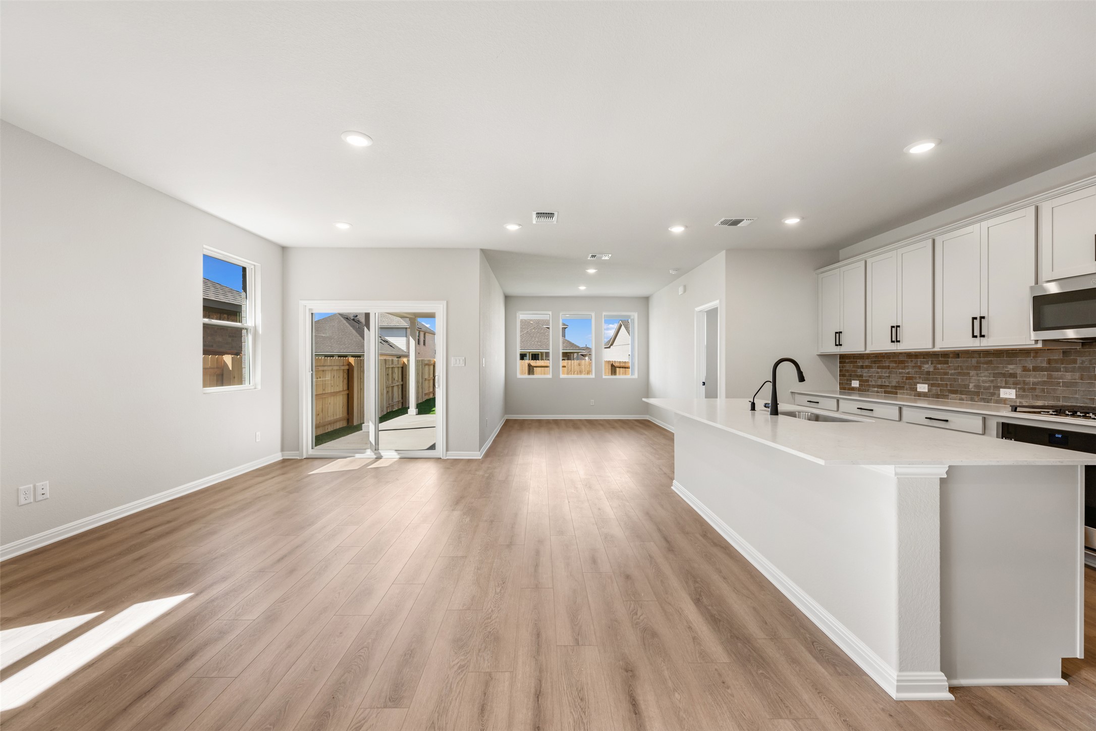 1036 Sienna Bear Road Georgetown, TX 78633 - Photo 29 of 33 a view of a kitchen with wooden floor