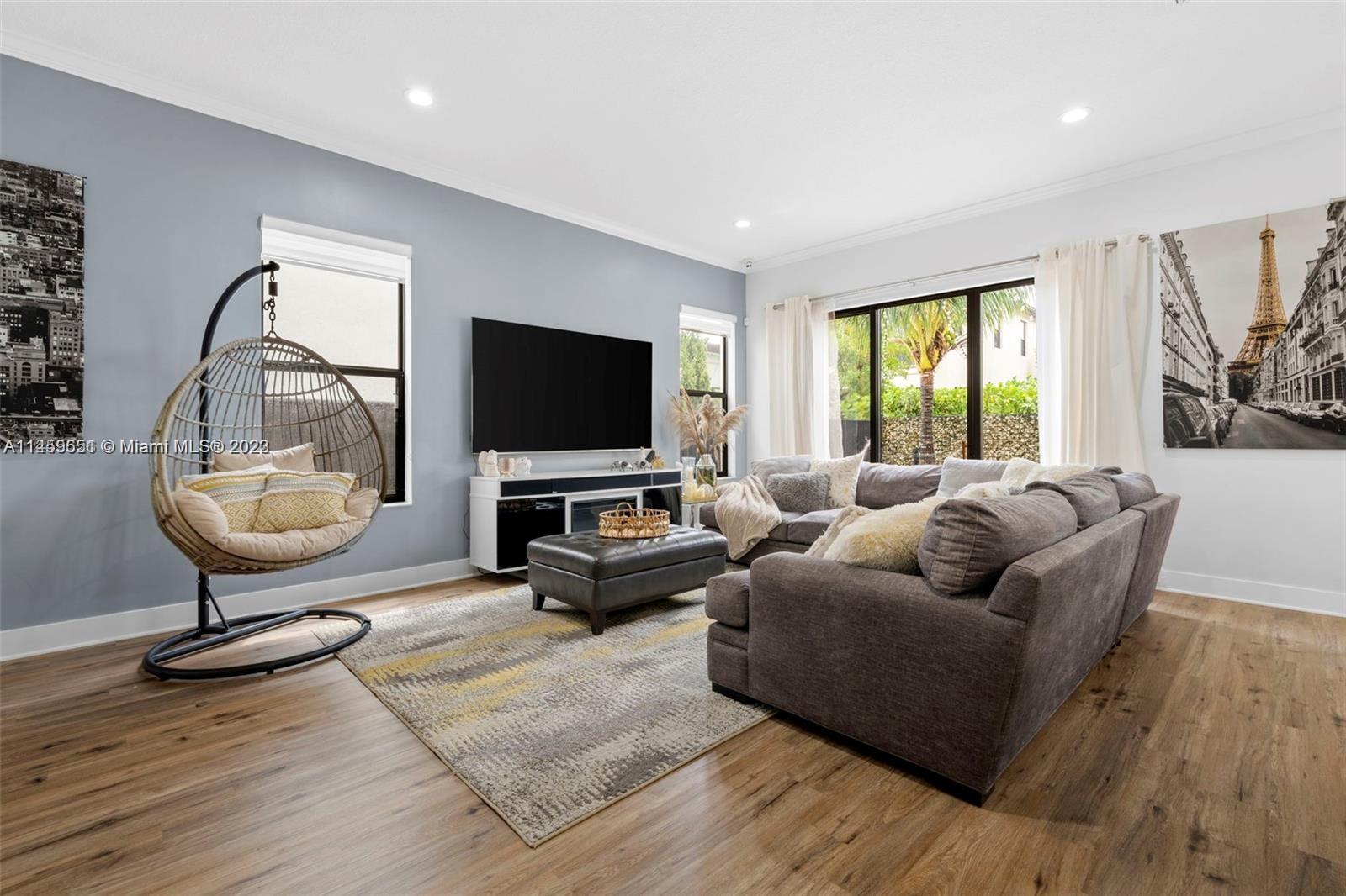 Hialeah Hialeah, FL 33018 - Photo 12 of 54 a living room with furniture and a flat screen tv