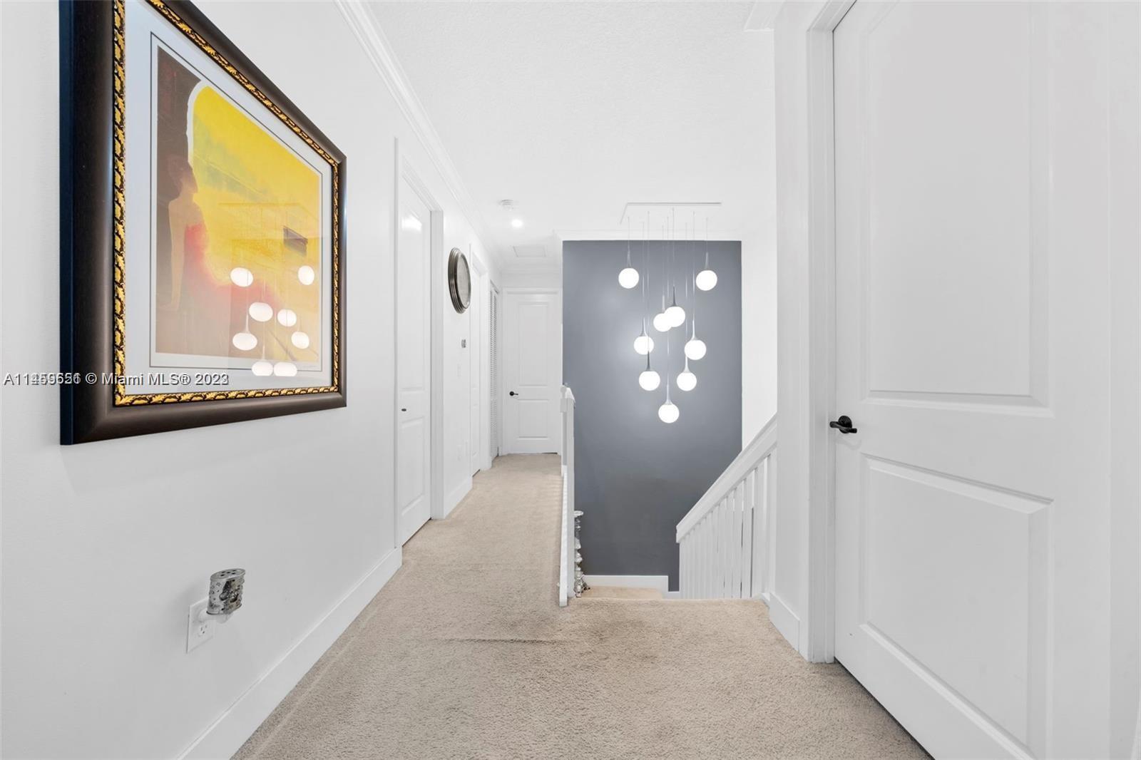 Hialeah Hialeah, FL 33018 - Photo 13 of 54 a view of a hallway with wooden shelves