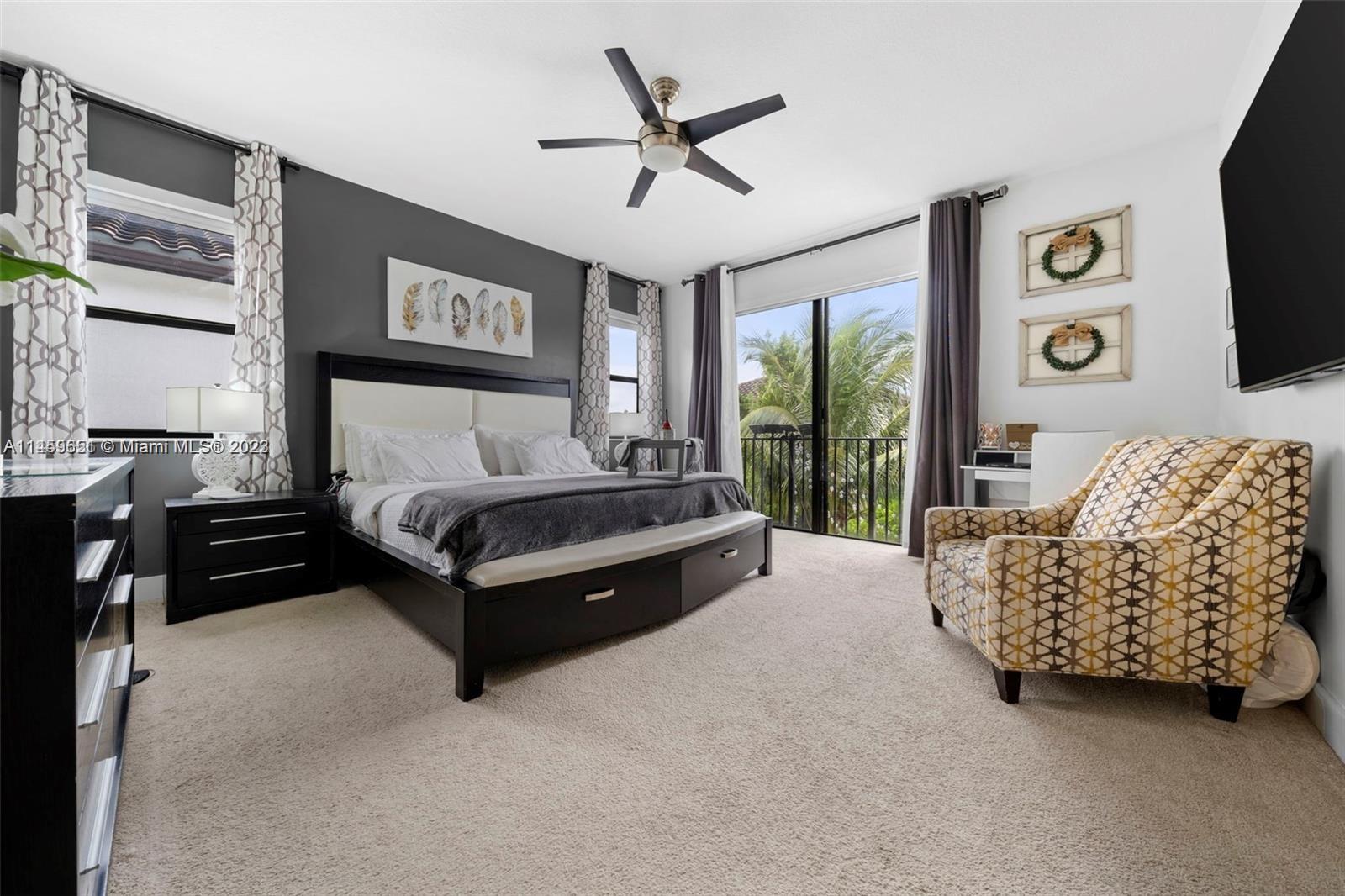 Hialeah Hialeah, FL 33018 - Photo 15 of 54 a spacious bedroom with a bed and a couch