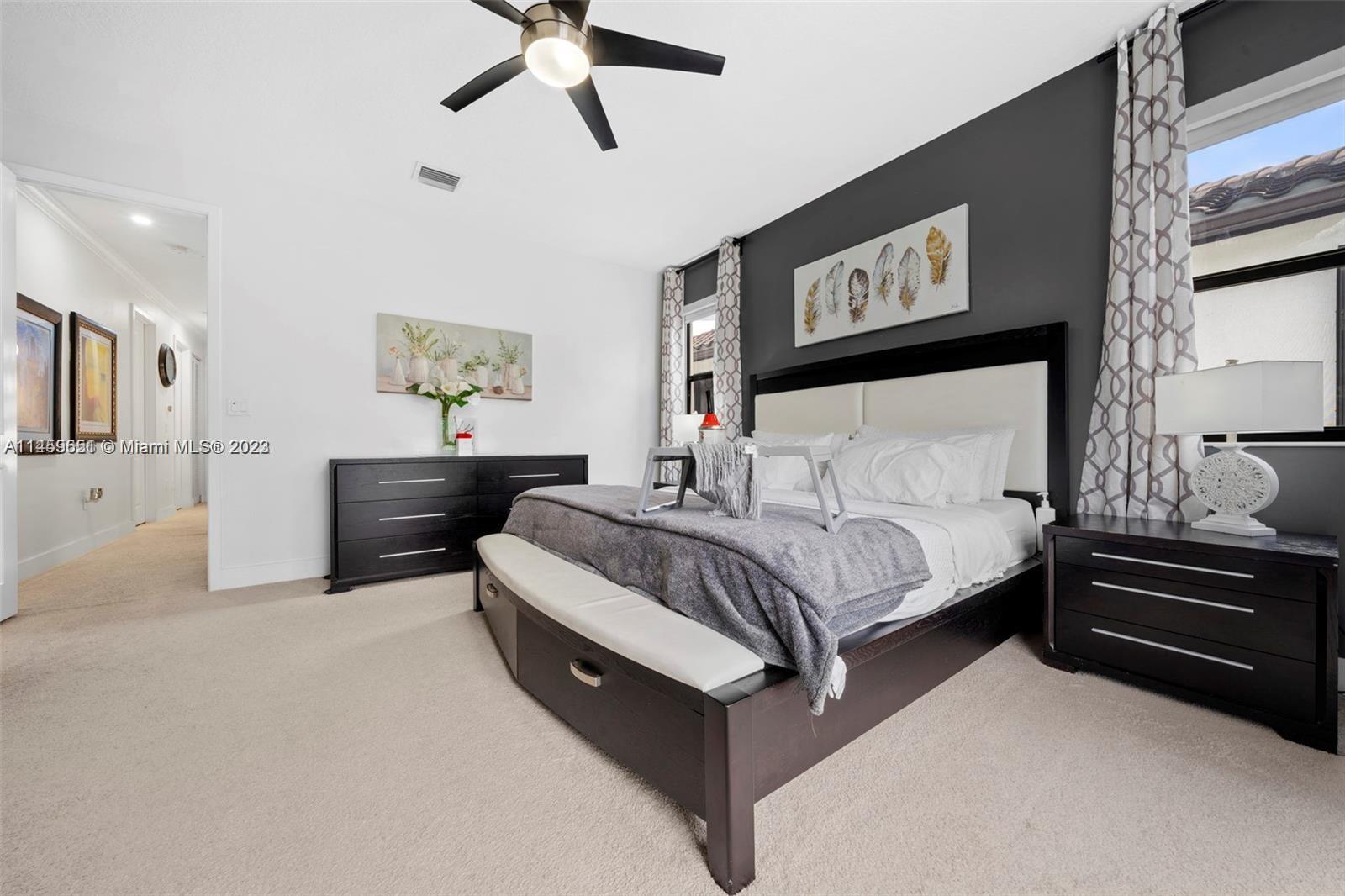 Hialeah Hialeah, FL 33018 - Photo 17 of 54 a bedroom with a bed and ceiling fan