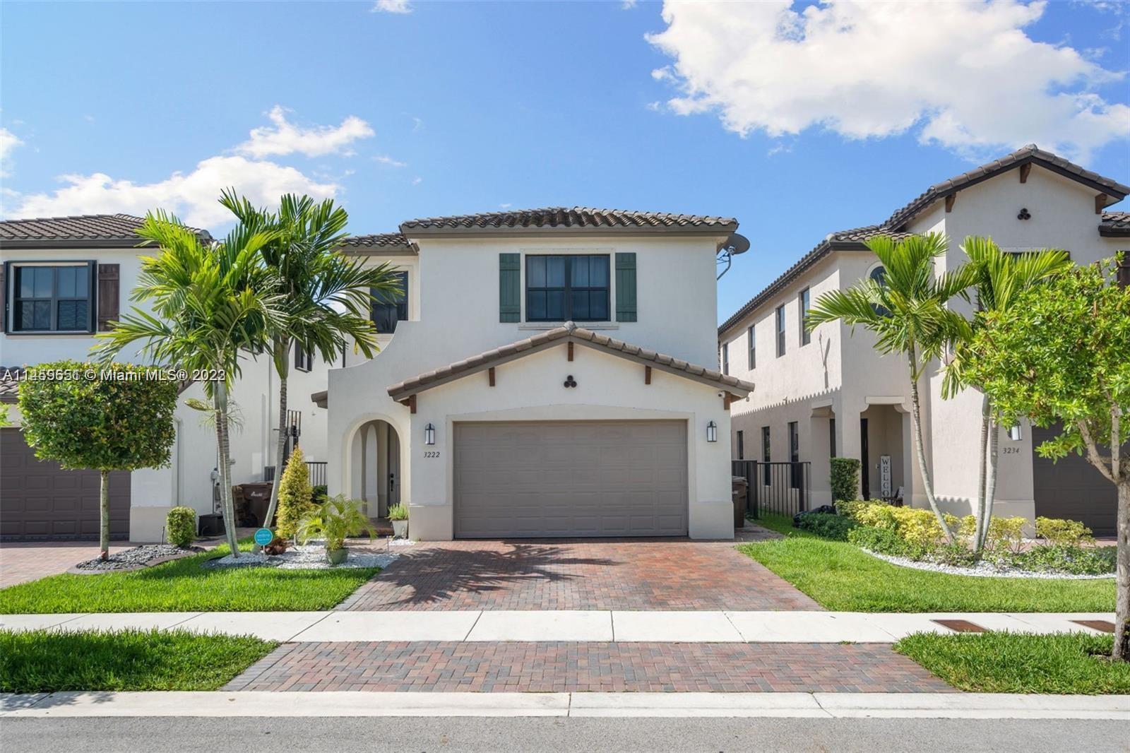 Hialeah Hialeah, FL 33018 - Photo 2 of 54 a front view of a house with a garden and garage