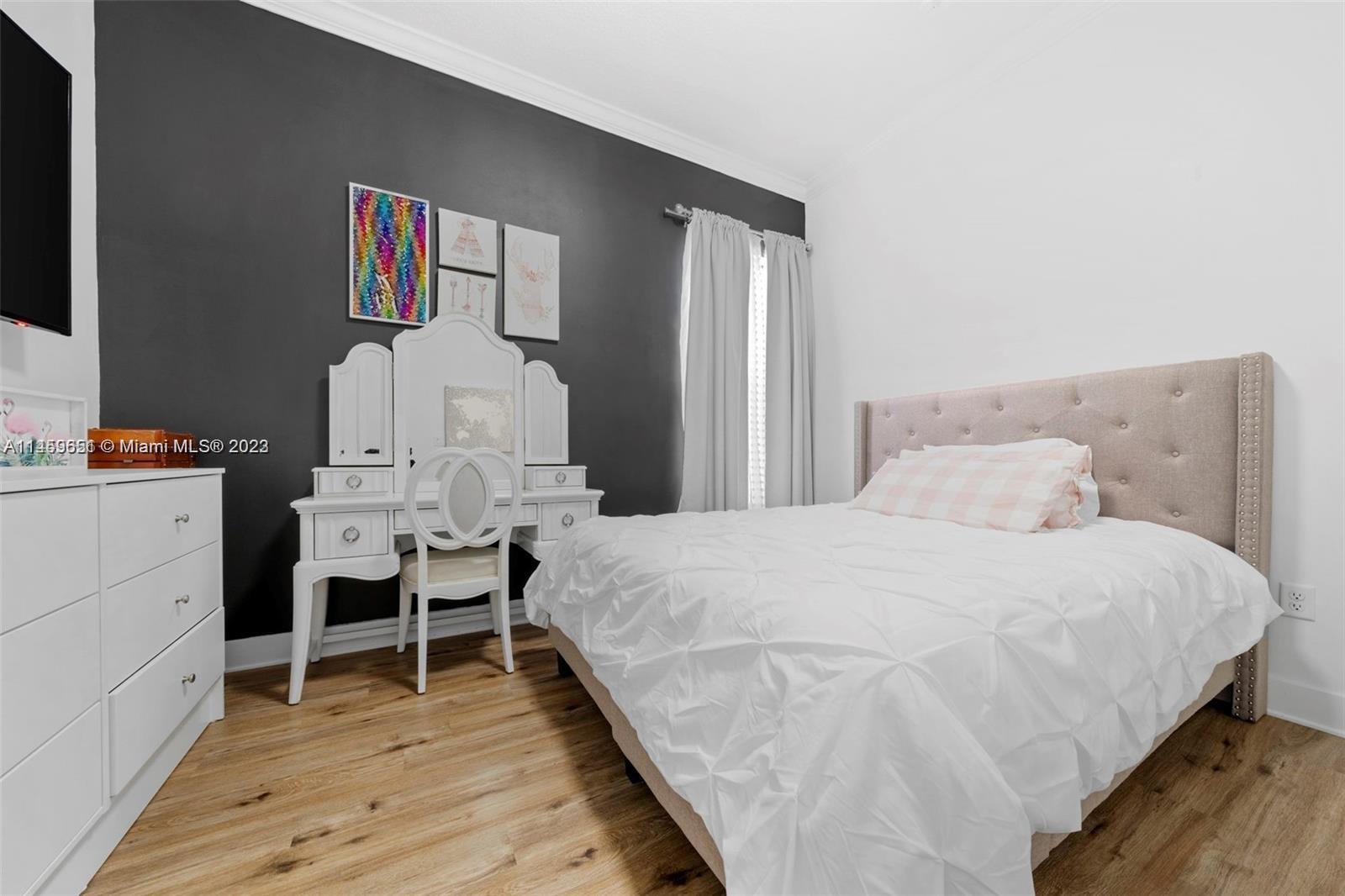 Hialeah Hialeah, FL 33018 - Photo 23 of 54 a bed room with a bed and a chair