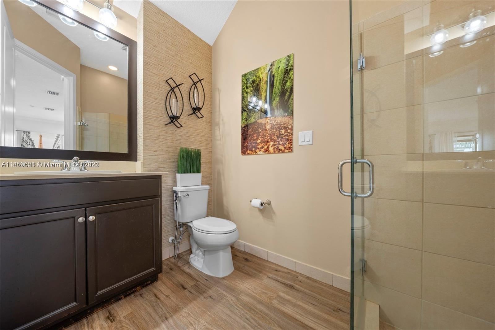 Hialeah Hialeah, FL 33018 - Photo 24 of 54 a bathroom with a sink toilet a mirror and shower