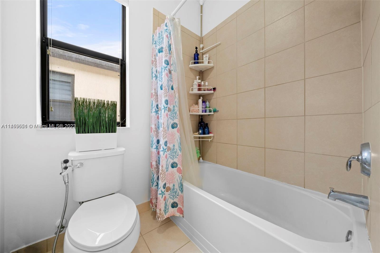 Hialeah Hialeah, FL 33018 - Photo 25 of 54 a bathroom with a toilet and a bathtub