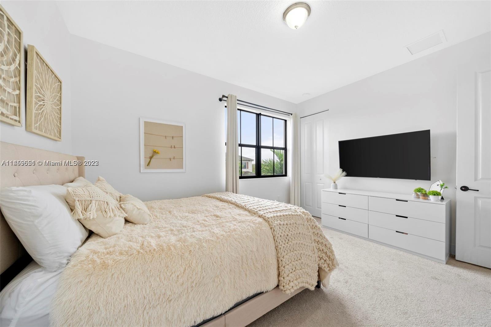 Hialeah Hialeah, FL 33018 - Photo 27 of 54 a bedroom with a bed and a flat screen tv