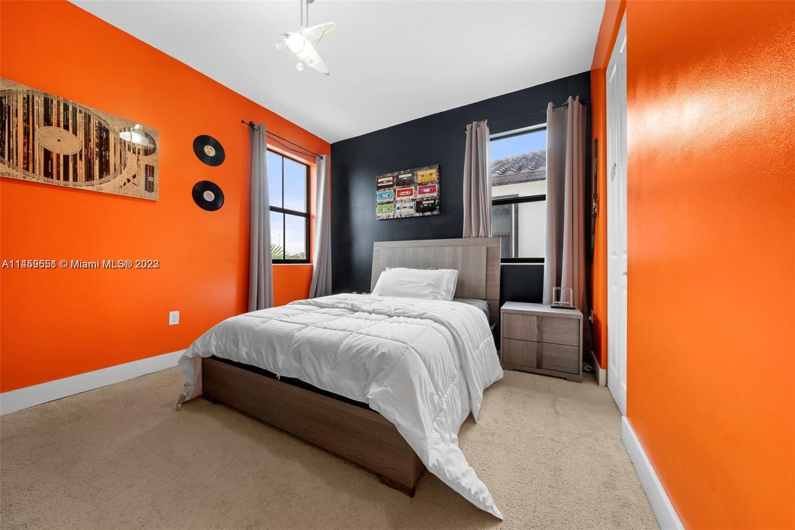 Hialeah Hialeah, FL 33018 - Photo 28 of 54 a bed room with a bed and a large mirror