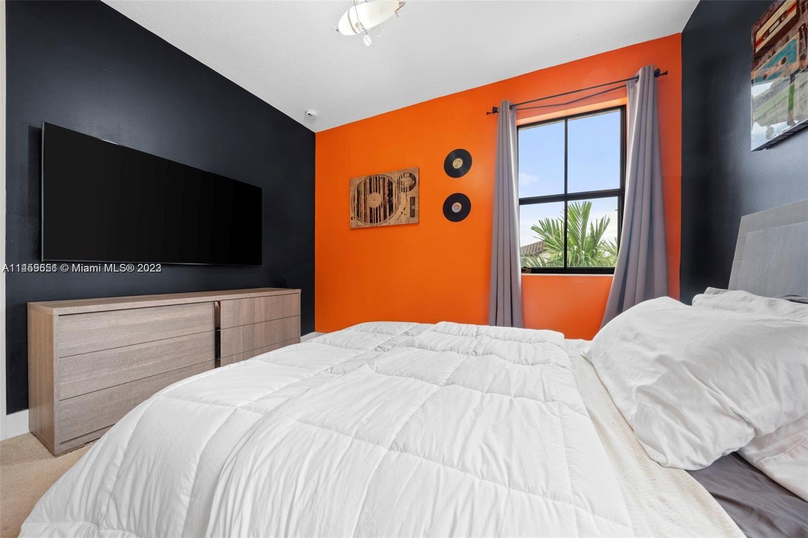 Hialeah Hialeah, FL 33018 - Photo 30 of 54 a bedroom with a bed and a flat screen tv