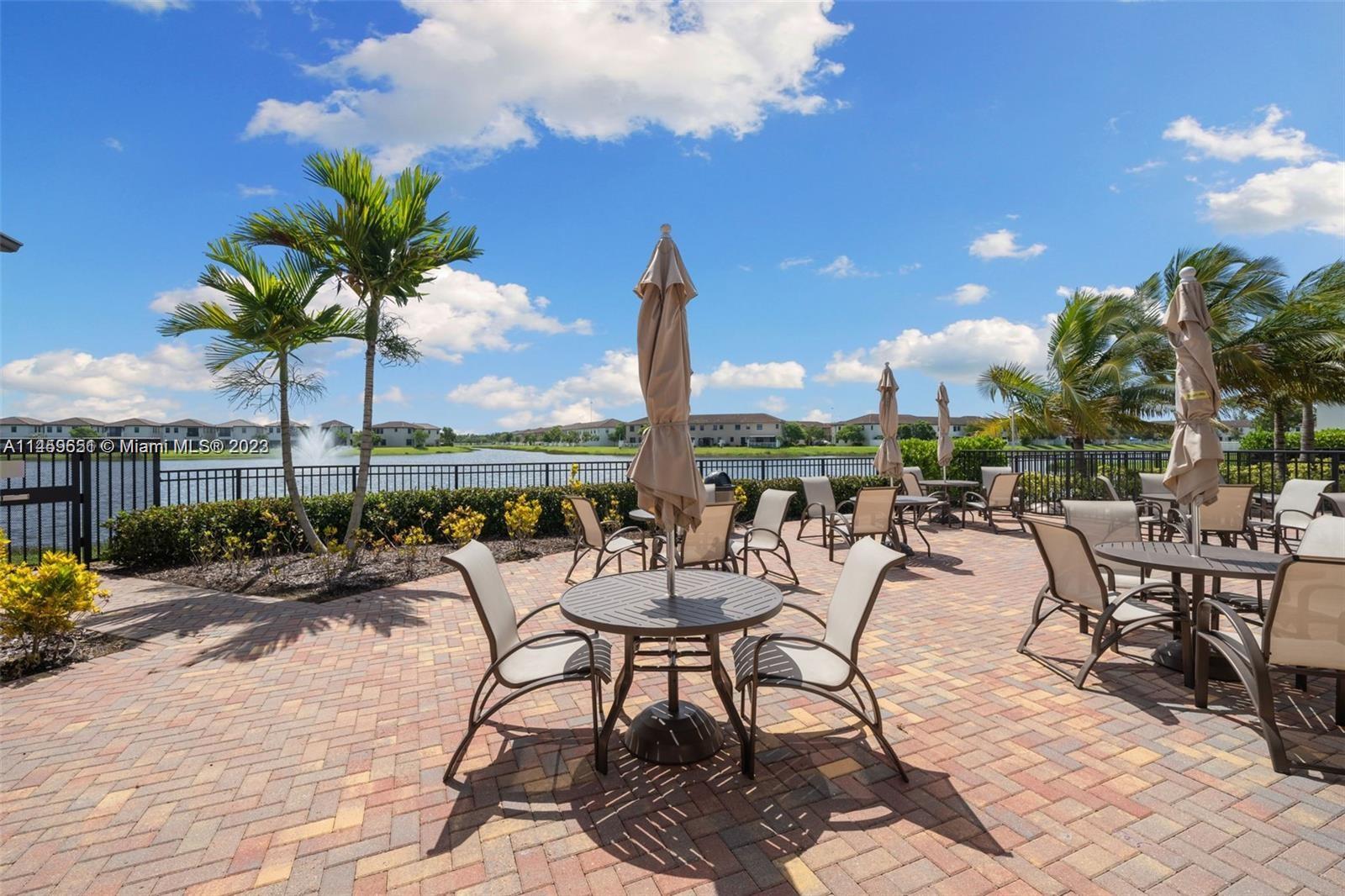 Hialeah Hialeah, FL 33018 - Photo 43 of 54 a view of a patio with a table and chairs and potted plants
