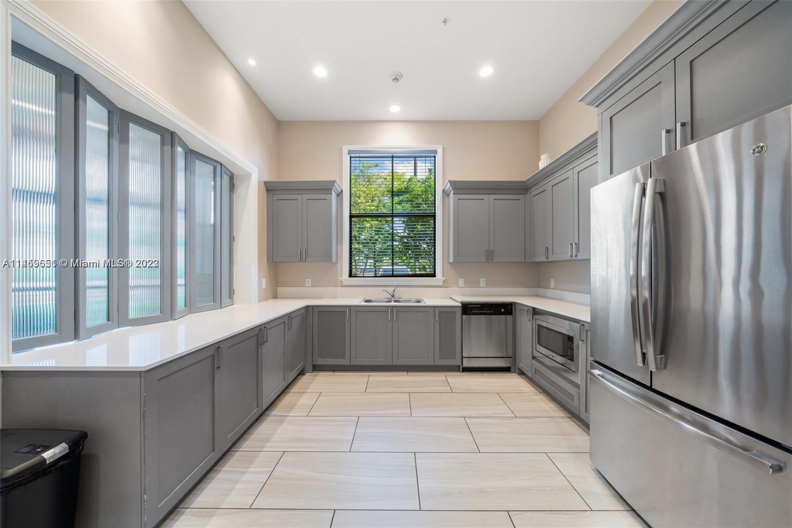 Hialeah Hialeah, FL 33018 - Photo 48 of 54 a large kitchen with a large window