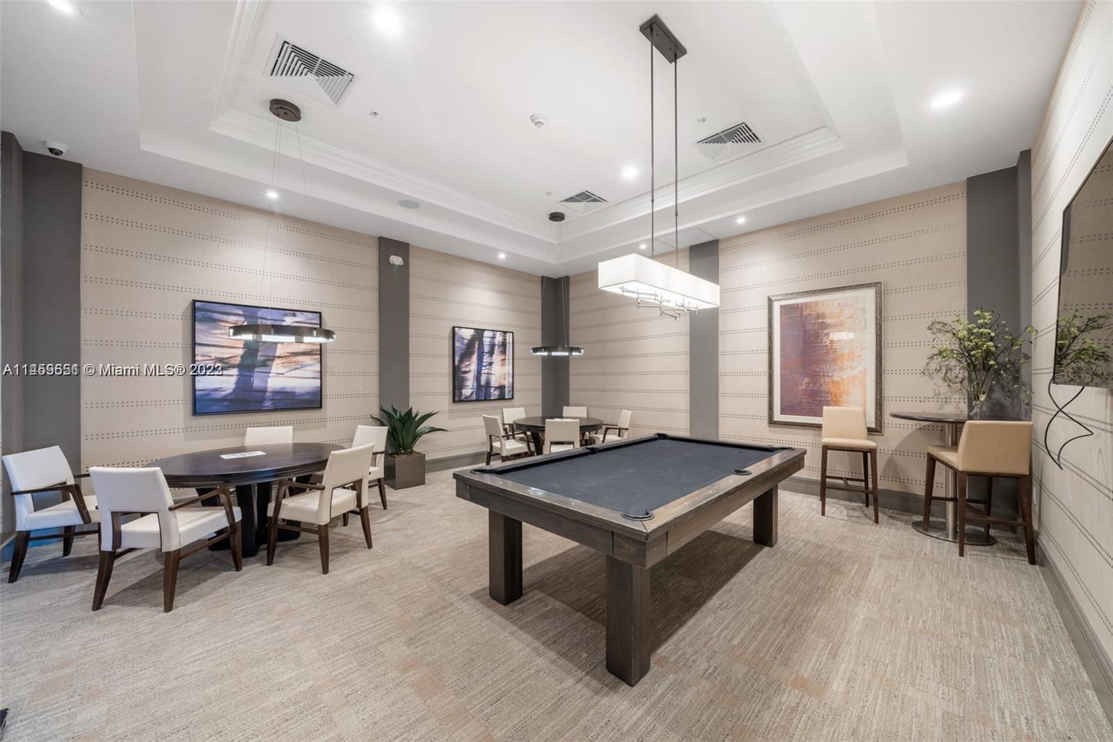 Hialeah Hialeah, FL 33018 - Photo 51 of 54 a living room with furniture a table and a large window