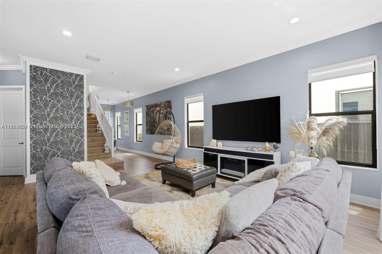 Hialeah Hialeah, FL 33018 - Photo 10 of 54 a living room with furniture and a flat screen tv