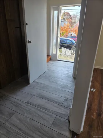 a view of a porch with wooden floor