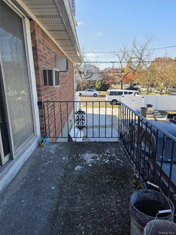 a view of an entryway door with a hallway