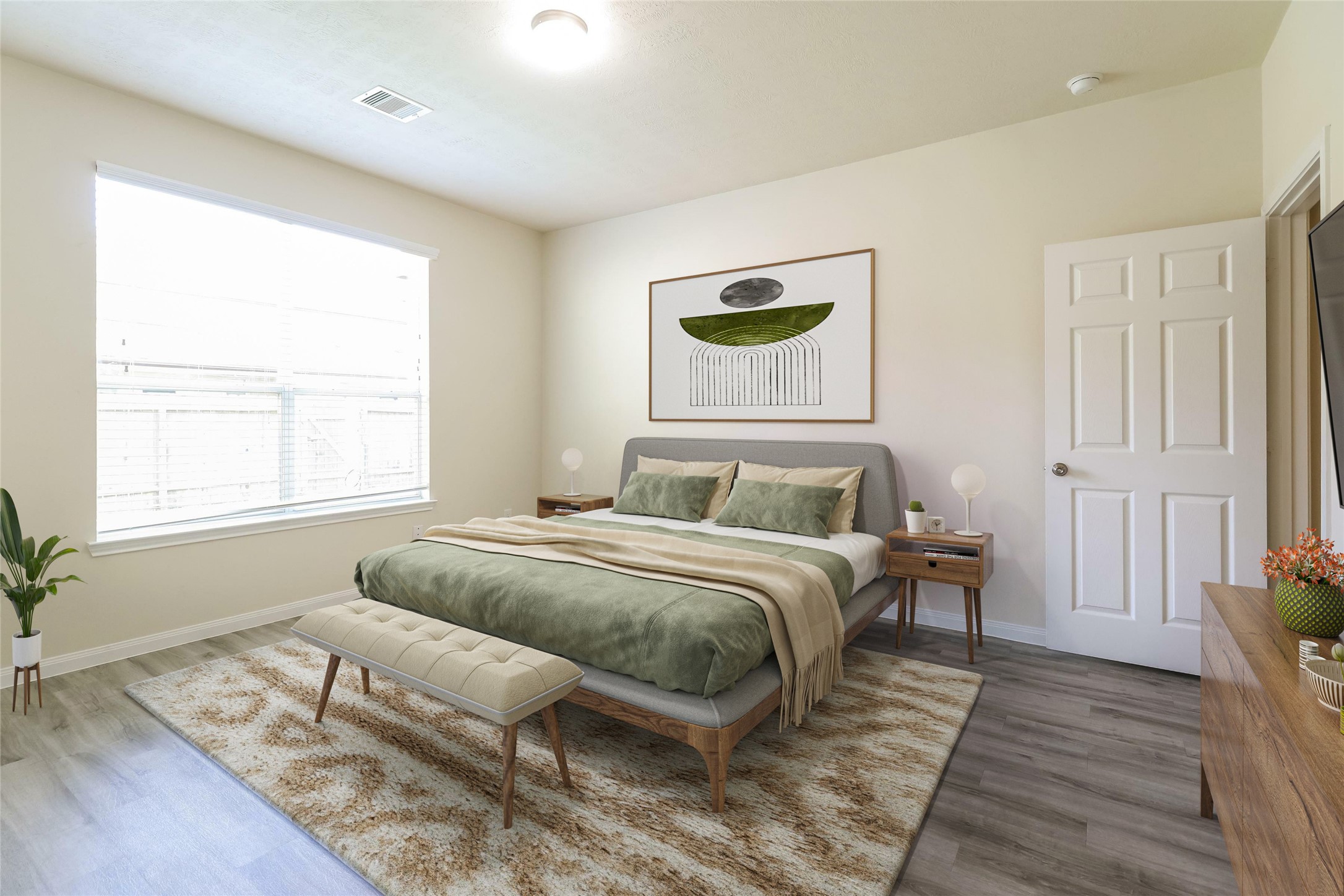 12235 Roy Mix Bohn Lane Houston, TX 77044 - Photo 4 of 16 a bedroom with a bed and a window