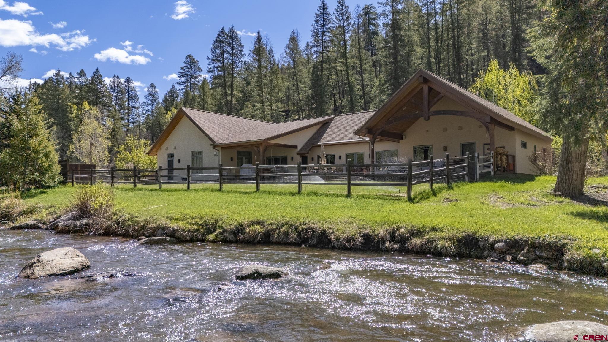 99 River Road Durango, CO 81301 - Photo 1 of 44 a front view of a house with garden