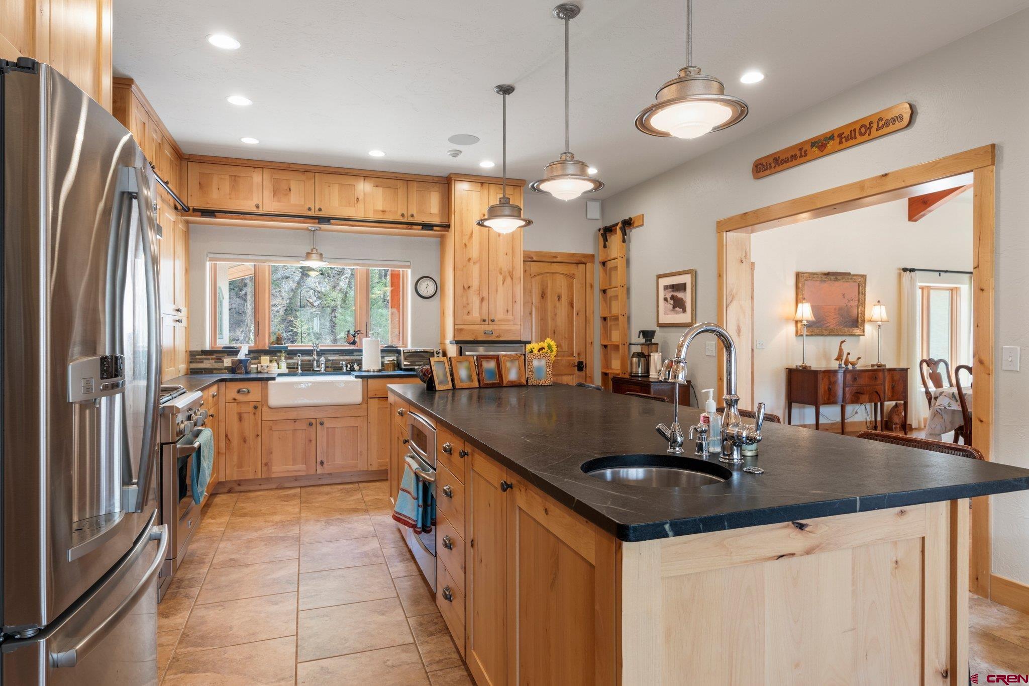 99 River Road Durango, CO 81301 - Photo 12 of 44 a kitchen with counter top space a sink and cabinets