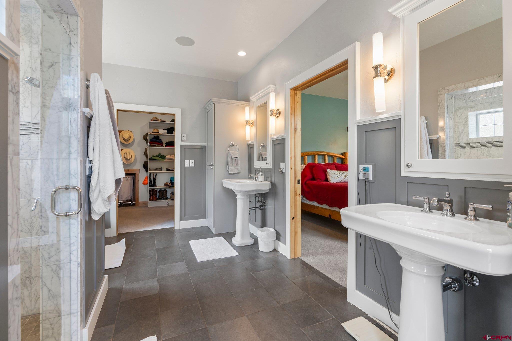 99 River Road Durango, CO 81301 - Photo 20 of 44 a en suite bathroom with a double vanity sink and shower