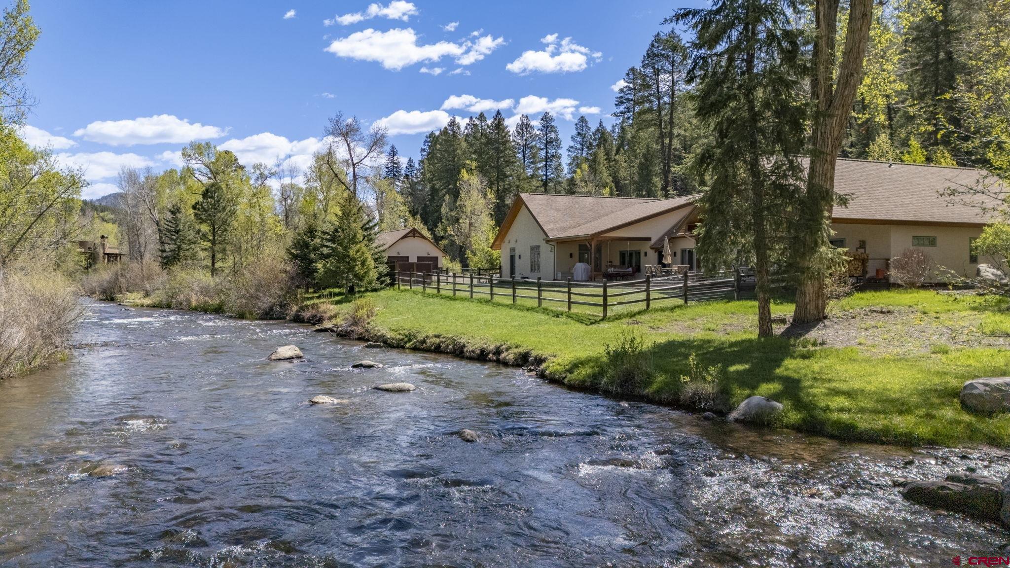 99 River Road Durango, CO 81301 - Photo 2 of 44 a view of a house with a backyard porch and sitting area