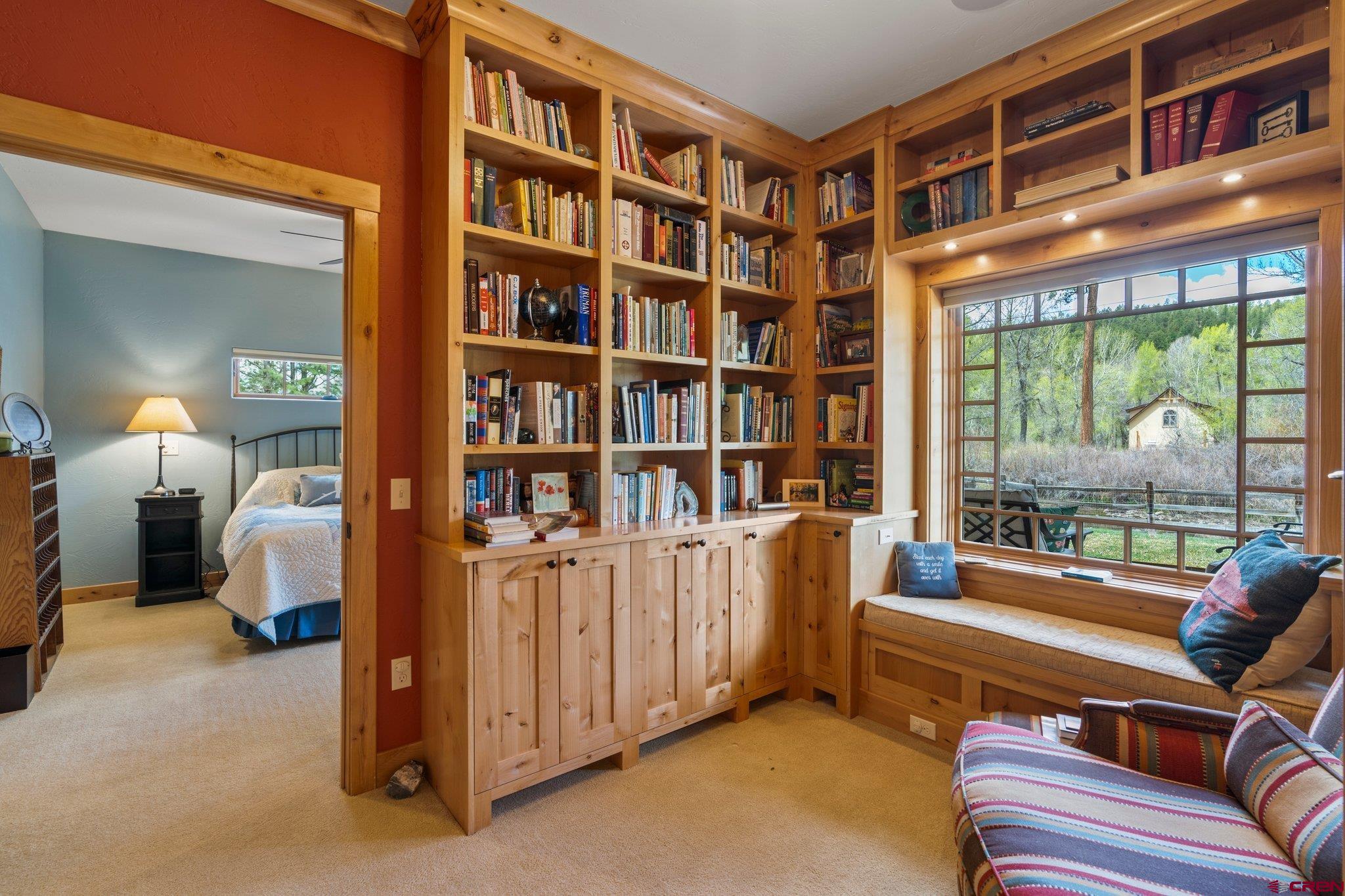 99 River Road Durango, CO 81301 - Photo 22 of 44 a bedroom with furniture and a book shelf