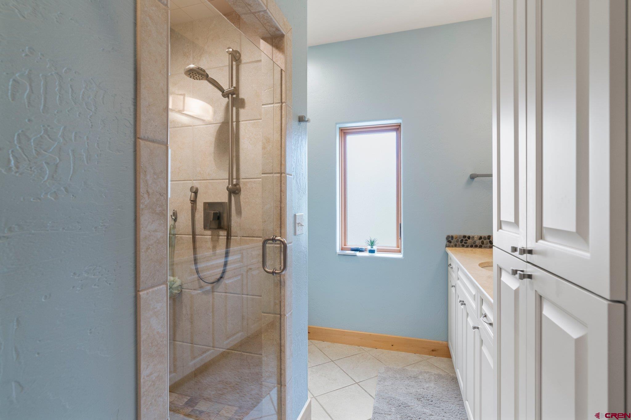 99 River Road Durango, CO 81301 - Photo 26 of 44 a bathroom with a tub sink and mirror