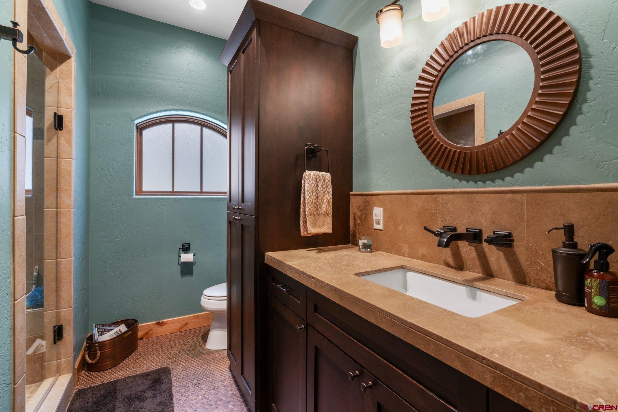 99 River Road Durango, CO 81301 - Photo 27 of 44 a bathroom with a sink and mirror