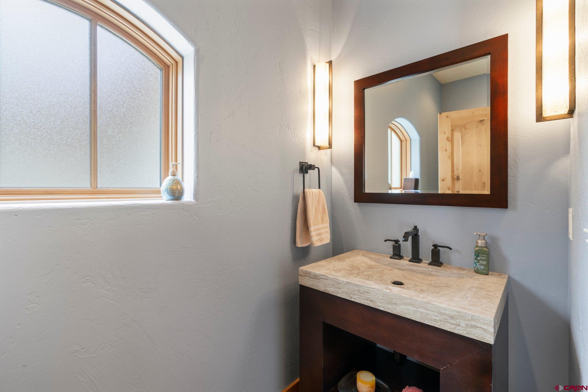 99 River Road Durango, CO 81301 - Photo 28 of 44 a bathroom with a sink and a mirror