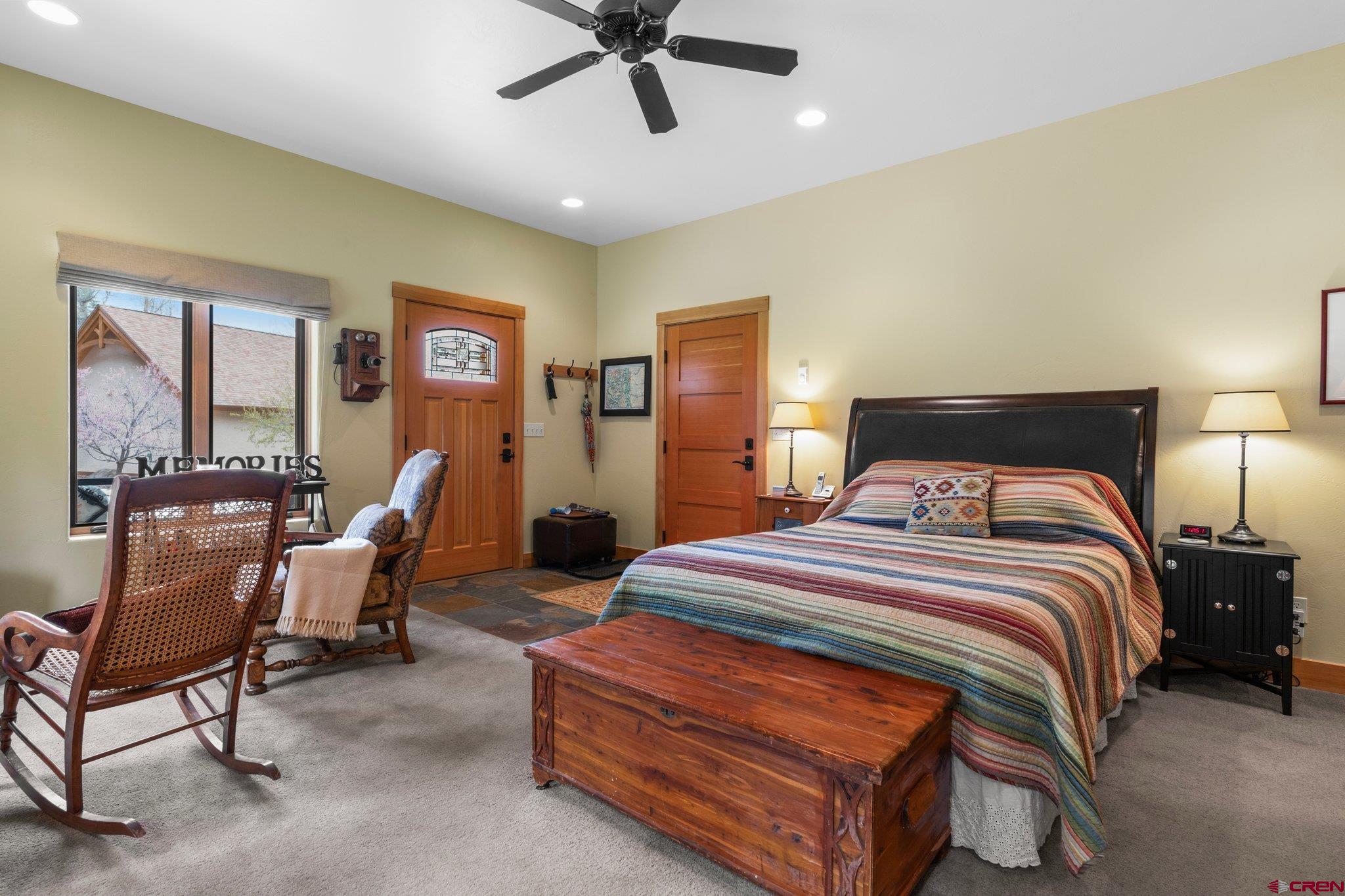 99 River Road Durango, CO 81301 - Photo 33 of 44 a bedroom with a bed chair and window