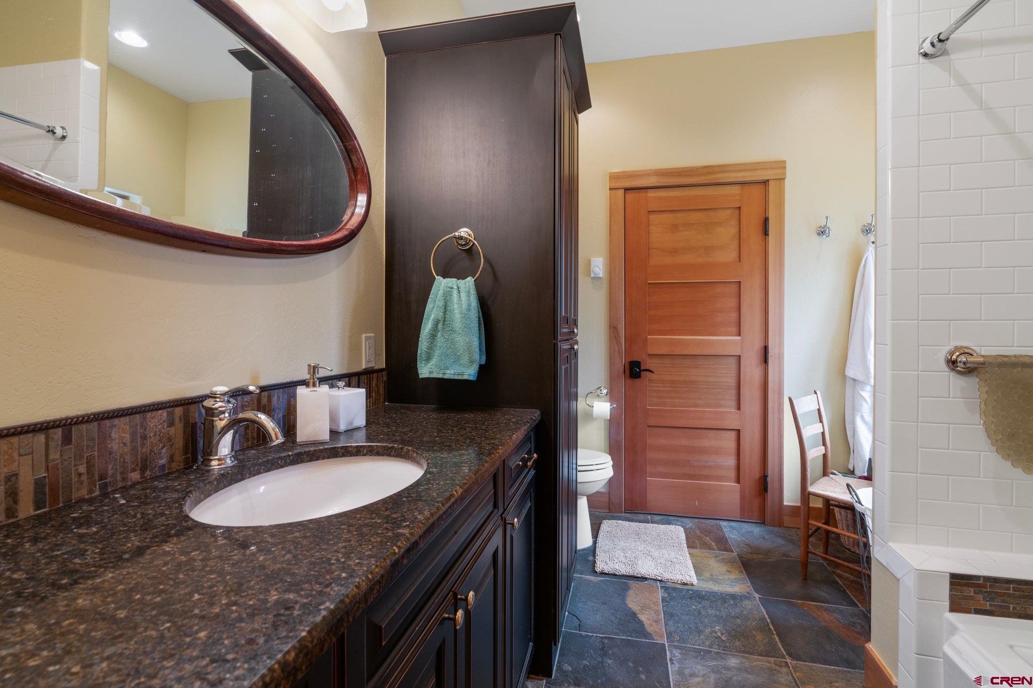 99 River Road Durango, CO 81301 - Photo 35 of 44 a bathroom with a sink double vanity and a mirror