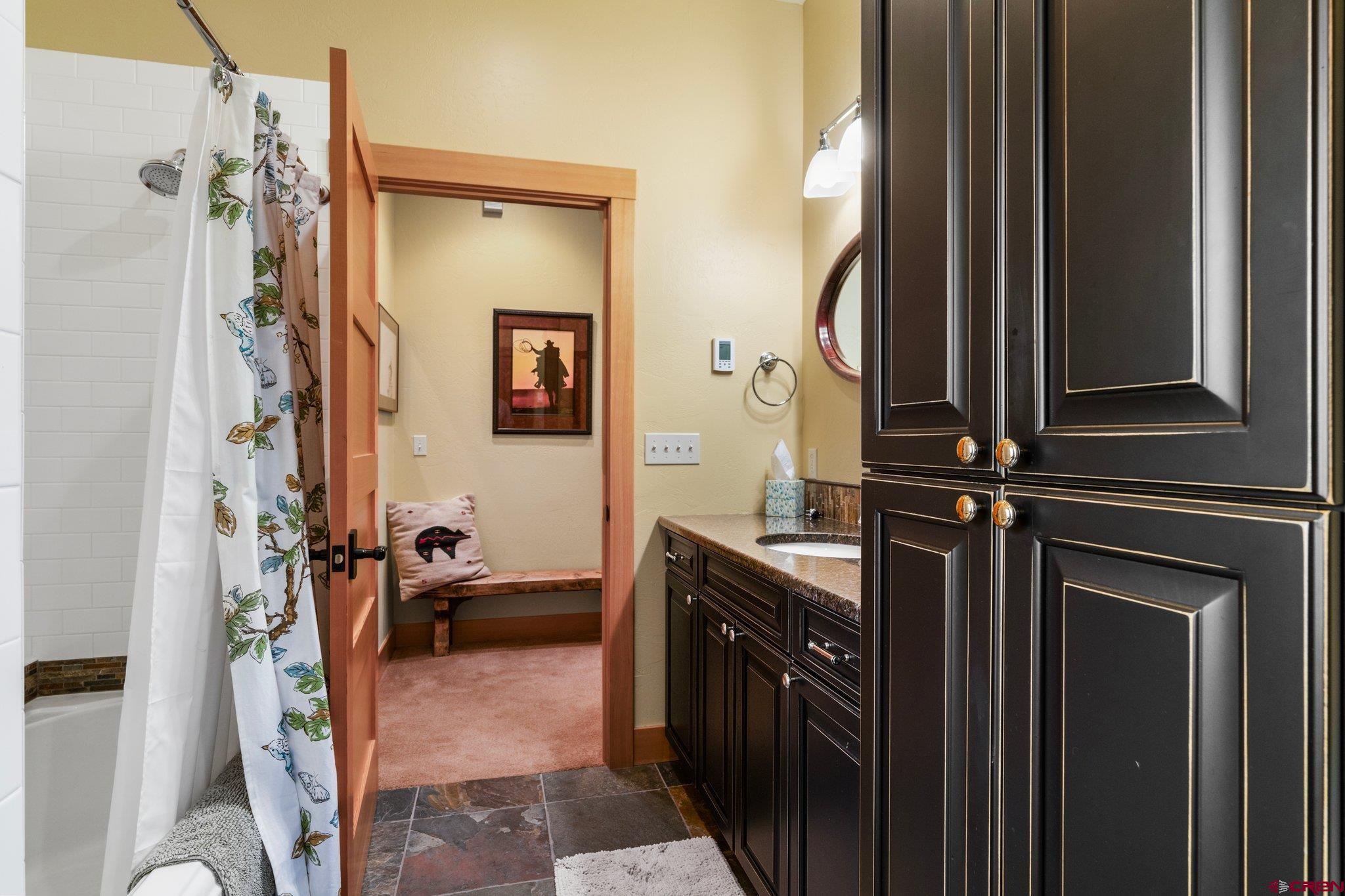 99 River Road Durango, CO 81301 - Photo 36 of 44 a bathroom with a mirror and a sink