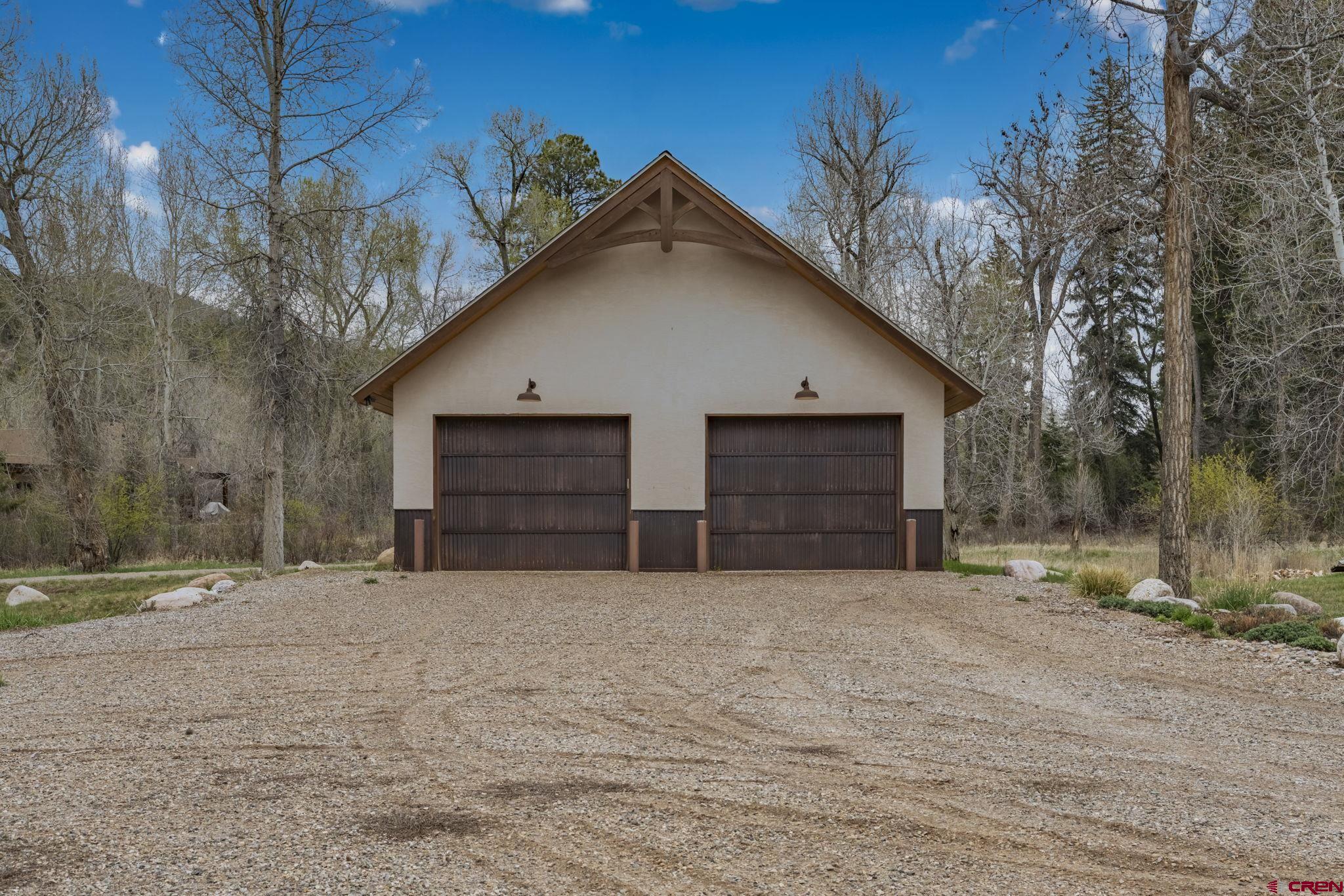 99 River Road Durango, CO 81301 - Photo 41 of 44 a view of a house with a yard and garage