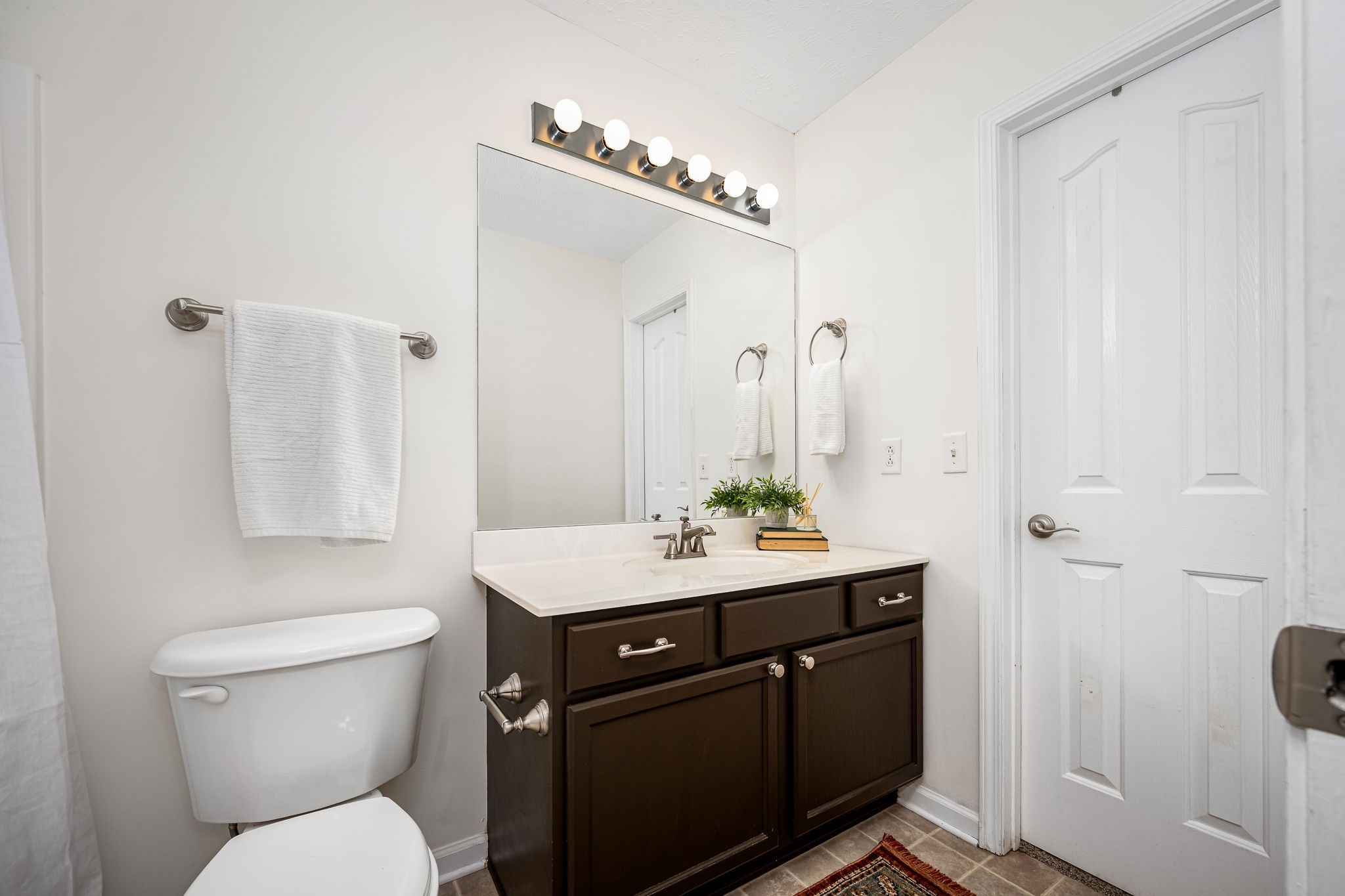 3216 Terrapin Court Murfreesboro, TN 37128 - Photo 11 of 17 a bathroom with a granite countertop sink a toilet a mirror and shower