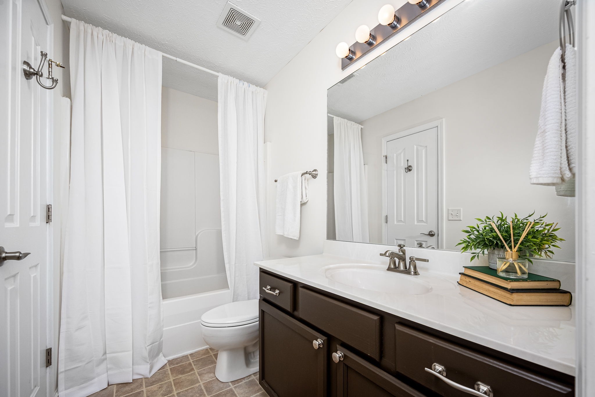 3216 Terrapin Court Murfreesboro, TN 37128 - Photo 15 of 17 a bathroom with a sink a toilet and a large mirror