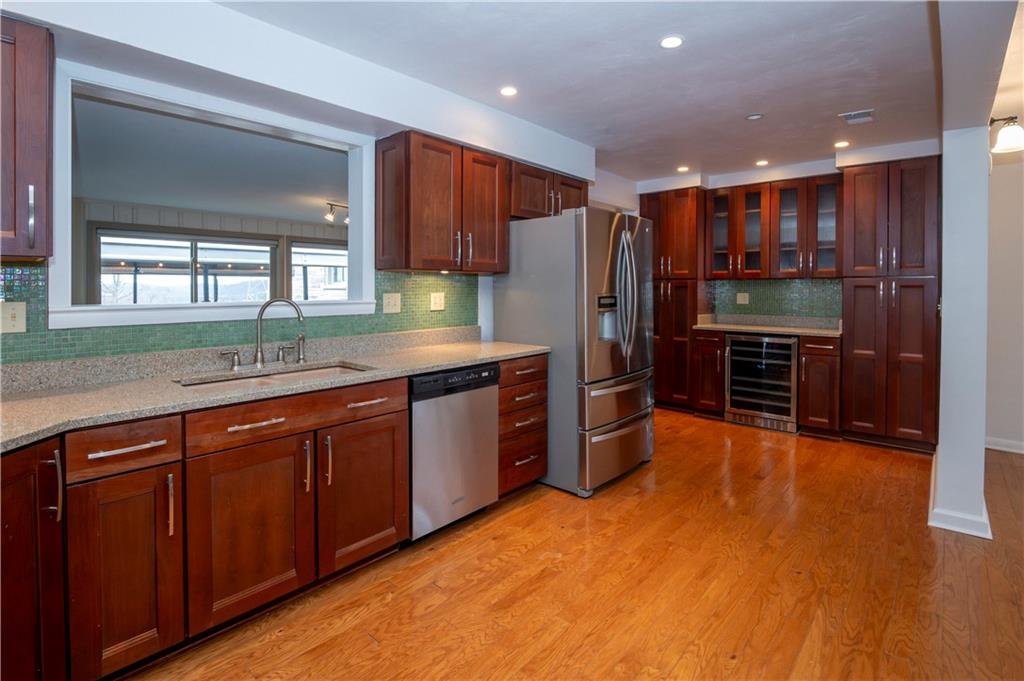 235 Highview Avenue Pittsburgh, PA 15238 - Photo 12 of 39 a kitchen with stainless steel appliances granite countertop a refrigerator and a sink