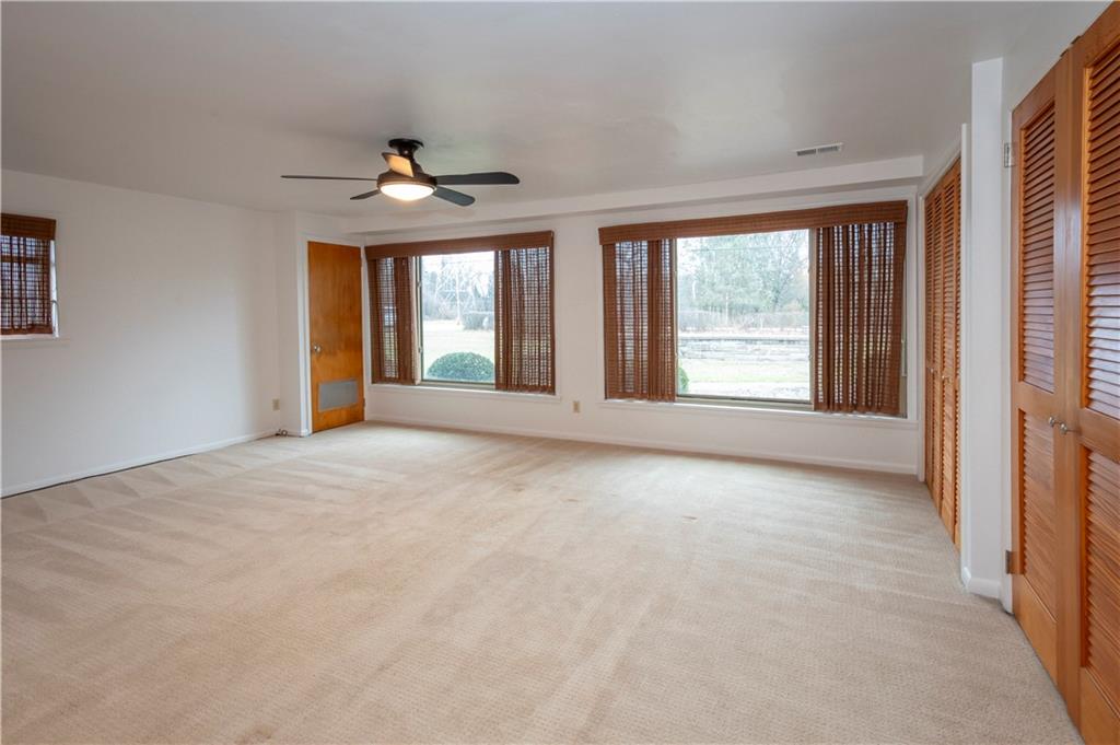 235 Highview Avenue Pittsburgh, PA 15238 - Photo 21 of 39 a view of an empty room with chandelier fan and windows
