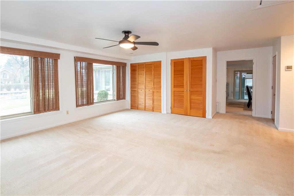 235 Highview Avenue Pittsburgh, PA 15238 - Photo 22 of 39 a view of an empty room with a window and a kitchen