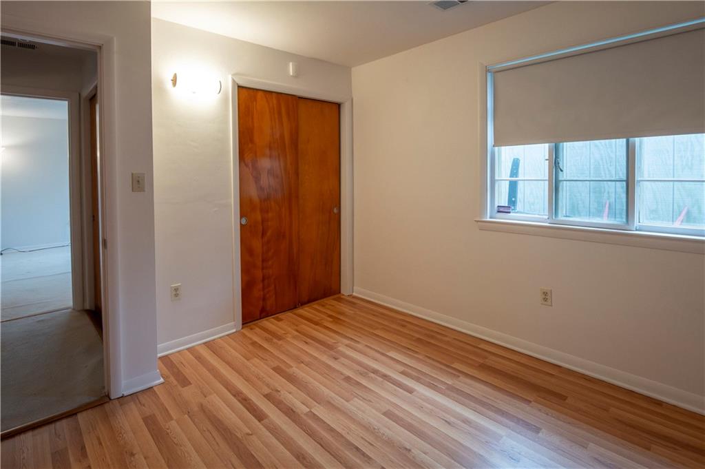 235 Highview Avenue Pittsburgh, PA 15238 - Photo 28 of 39 an empty room with wooden floor and windows