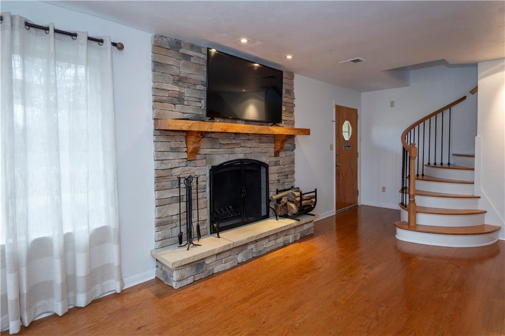 235 Highview Avenue Pittsburgh, PA 15238 - Photo 8 of 39 a living room with furniture and a fireplace