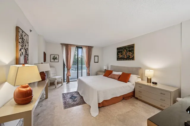 a bathroom with a tub a sink a mirror and a shower