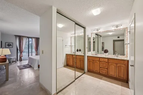 a bathroom with a toilet sink and shower
