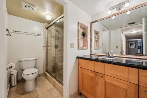 a close view of a utility room with washer and dryer
